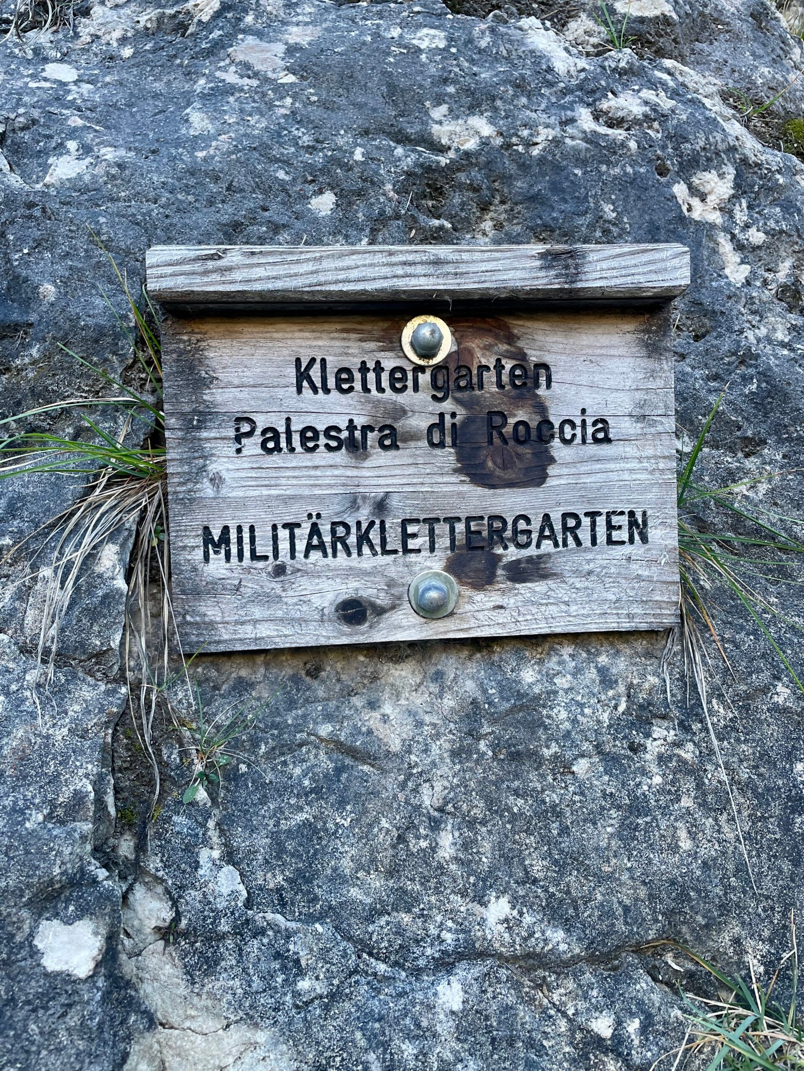 Militärklettergarten climbing guide — the crag name sign at the base of the wall in Val di Landro, Dolomites